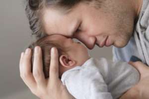 Father with newborn baby