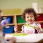 preschooler eating pasta